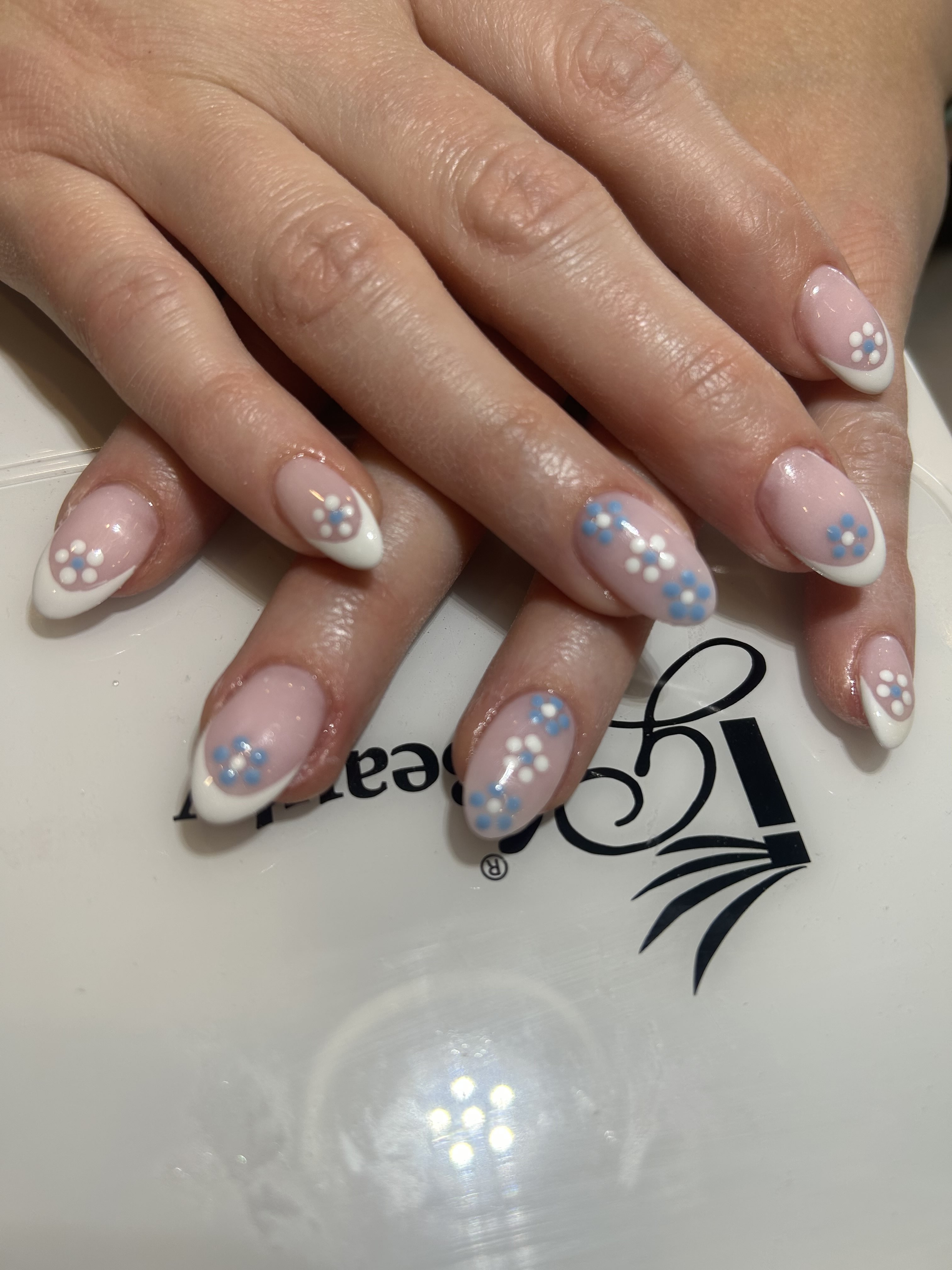 Cute Baby Blue and White Flower Designs with White French Tip Almond Nails